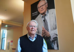 Professor-David-Aaker-with-poster_May-2025-scaled.jpg